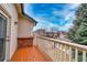 Cozy deck with painted wood floor and railing, perfect for outdoor relaxation at 2991 S Zeno Way, Aurora, CO 80013