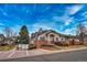 Attractive exterior view of the townhouse showcases lush landscaping and classic architectural details at 2991 S Zeno Way, Aurora, CO 80013