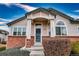 Charming home featuring a welcoming front entrance and well-maintained landscaping at 2991 S Zeno Way, Aurora, CO 80013