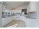 Well-lit kitchen featuring a full suite of appliances and stylish backsplash at 2991 S Zeno Way, Aurora, CO 80013