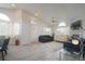 Cozy living room with vaulted ceilings, large windows, and comfortable seating arrangement at 2991 S Zeno Way, Aurora, CO 80013