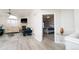 Living room with hardwood floors, fireplace, and views into the adjacent bedroom at 2991 S Zeno Way, Aurora, CO 80013
