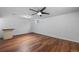 Finished basement featuring a large area with a ceiling fan, laminate flooring, and natural light at 7755 E Quincy Ave # T48, Denver, CO 80209