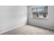 Bedroom featuring neutral-toned carpet and a window view of the outdoors at 7755 E Quincy Ave # T48, Denver, CO 80209