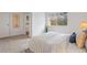 Bright bedroom featuring a comfortable bed and a window view of the outdoors at 7755 E Quincy Ave # T48, Denver, CO 80209
