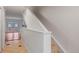 Hallway featuring tile floor, staircase and access to a living area at 7755 E Quincy Ave # T48, Denver, CO 80209