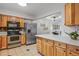 Kitchen with stainless steel appliances, light cabinetry and quartz countertops at 7755 E Quincy Ave # T48, Denver, CO 80209