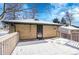 Backyard with deck and brick exterior wall at 749 Poplar St, Denver, CO 80220