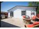 A cozy backyard layout features a stone patio with firepit and BBQ, perfect for enjoying outdoor living at 1522 Willow St, Denver, CO 80220