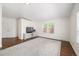 Spacious bedroom with hardwood floors, neutral walls, and large windows providing ample natural light at 1522 Willow St, Denver, CO 80220