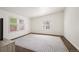 Light-filled bedroom with hardwood floors, vaulted ceiling, and multiple windows offering great natural light at 1522 Willow St, Denver, CO 80220
