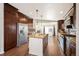 Modern kitchen featuring stainless steel appliances, granite countertops, ample cabinetry and kitchen island at 1522 Willow St, Denver, CO 80220