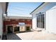 Outdoor patio with a built-in BBQ grill and sliding door entry into the house, perfect for outdoor entertaining at 1522 Willow St, Denver, CO 80220