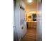 Hallway view of the washer and dryer closet leading into the bathroom at 9263 E Arbor Cir # B, Englewood, CO 80111