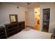 Well-lit bedroom with a walk-in closet and ensuite bathroom with washer and dryer at 9263 E Arbor Cir # B, Englewood, CO 80111