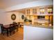 Charming dining area with a wooden table, stylish chairs, and a granite countertop perfect for entertaining at 9263 E Arbor Cir # B, Englewood, CO 80111