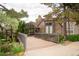Exterior view of building with unique architectural details, a bridge, and a welcoming entryway at 9263 E Arbor Cir # B, Englewood, CO 80111