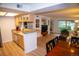 Open concept floorplan with a breakfast bar connecting the kitchen, dining, and living areas at 9263 E Arbor Cir # B, Englewood, CO 80111