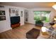 Cozy living room with a plush couch, large window, and ample natural light at 9263 E Arbor Cir # B, Englewood, CO 80111