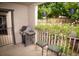 Outdoor patio area featuring a grill, quaint patio furniture, and floral accents at 9263 E Arbor Cir # B, Englewood, CO 80111