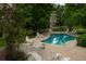 Inviting pool area surrounded by lush greenery and lounge chairs, perfect for summer relaxation at 9263 E Arbor Cir # B, Englewood, CO 80111