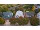 Aerial view of a home with a well-kept lawn and mature trees at 16456 Wagon Pl, Parker, CO 80134