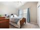 Cozy bedroom features a window with curtains and carpet floors at 16456 Wagon Pl, Parker, CO 80134