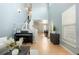 Spacious entryway featuring hardwood floors, a staircase, and a view into the dining area at 16456 Wagon Pl, Parker, CO 80134