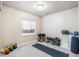 Bright exercise room equipped with weights, bench, yoga mat, and natural light at 16456 Wagon Pl, Parker, CO 80134