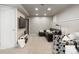 Finished basement living room featuring a seating area and a television with neutral walls and carpet at 16456 Wagon Pl, Parker, CO 80134