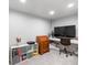 This carpeted office space features a white desk, chair, and an organization unit with gray storage cubes at 16456 Wagon Pl, Parker, CO 80134