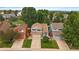 Aerial view of a home's exterior showing tidy lawns, driveway, and nearby houses and trees at 3528 Morning Glory Dr, Castle Rock, CO 80109