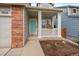 Inviting front porch featuring a decorative flower box and a vibrant turquoise front door at 3528 Morning Glory Dr, Castle Rock, CO 80109