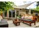 Relaxing backyard patio featuring comfortable seating, a shade cover, and a seamless indoor-outdoor transition at 6080 S Detroit St, Centennial, CO 80121