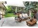 Comfortable backyard patio with a shade cover, an outdoor grill, and a beautiful green lawn at 6080 S Detroit St, Centennial, CO 80121