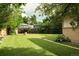 Beautifully landscaped backyard with lush lawn and mature trees, perfect for outdoor enjoyment at 6080 S Detroit St, Centennial, CO 80121