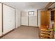 Finished basement with built-in closets and a window, offering ample storage and natural light at 6080 S Detroit St, Centennial, CO 80121