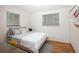 Bedroom featuring hardwood floors, bright natural light, and large windows, creating a serene space at 6080 S Detroit St, Centennial, CO 80121