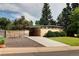 Striking home featuring a manicured lawn, contemporary driveway, and a well-maintained facade at 6080 S Detroit St, Centennial, CO 80121