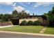 Contemporary home with lush landscaping, a modern driveway, and stylish architectural details at 6080 S Detroit St, Centennial, CO 80121