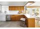 Bright, updated kitchen with tile floors, countertop seating, and plenty of storage at 6080 S Detroit St, Centennial, CO 80121