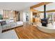 Open-concept living room boasts hardwood floors and a cozy seating area at 6080 S Detroit St, Centennial, CO 80121