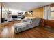 Spacious living room with wood paneling, stylish decor, and ample seating at 6080 S Detroit St, Centennial, CO 80121
