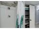 Bright bathroom with a shower, storage shelves, and modern finishes at 7201 E Quincy Ave # 103, Denver, CO 80237