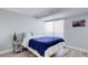 Comfortable bedroom with a large window providing natural light and a pleasant ambiance at 7201 E Quincy Ave # 103, Denver, CO 80237