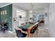The dining area features a wood table, black chairs, and a mirrored wall at 7201 E Quincy Ave # 103, Denver, CO 80237