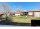 View of building exterior and landscaping at 7201 E Quincy Ave # 103, Denver, CO 80237