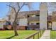Building exterior with grass and trees at 7201 E Quincy Ave # 103, Denver, CO 80237