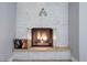 Cozy fireplace with brick surround and decorative accents at 7201 E Quincy Ave # 103, Denver, CO 80237