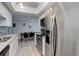Bright kitchen featuring stainless steel appliances and a view to the dining area at 7201 E Quincy Ave # 103, Denver, CO 80237